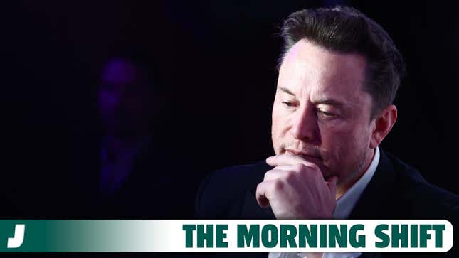 A photo of Elon Musk thinking on stage.